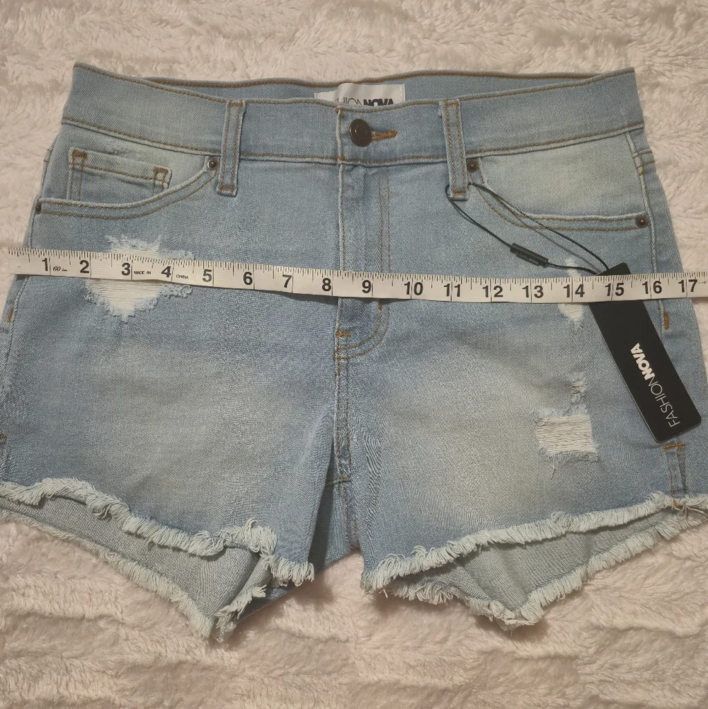 Fashion Nova Light Blue‎ Distressed Denim Cutoff Shorts